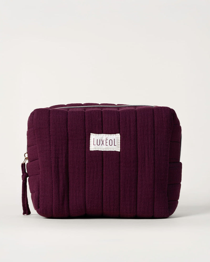 Trousse matelassée violette