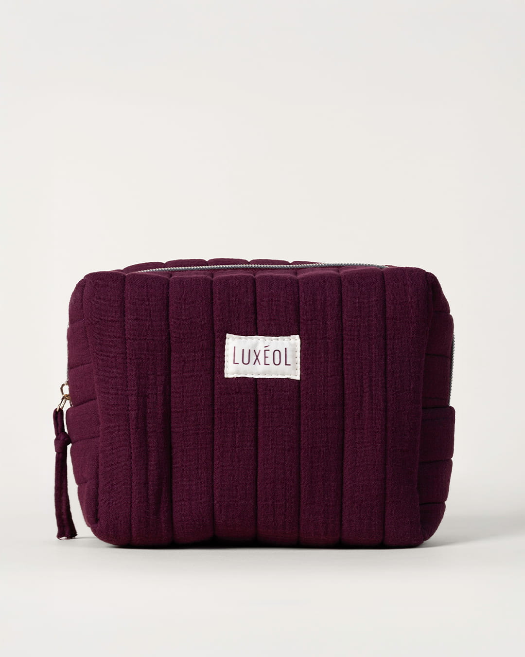Trousse matelassée violette